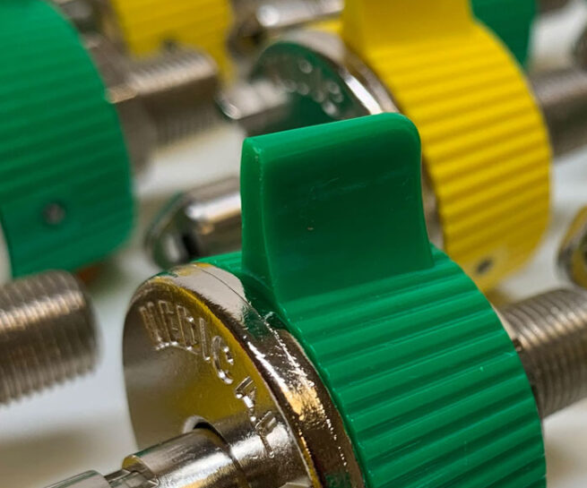 Close up photo of ohmeda style quick connect medical fitting in air and oxygen gas types